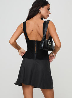 back view of model wearing Princess Polly Dapple Bias Mini Skirt Black Mini Skirts Skirts 