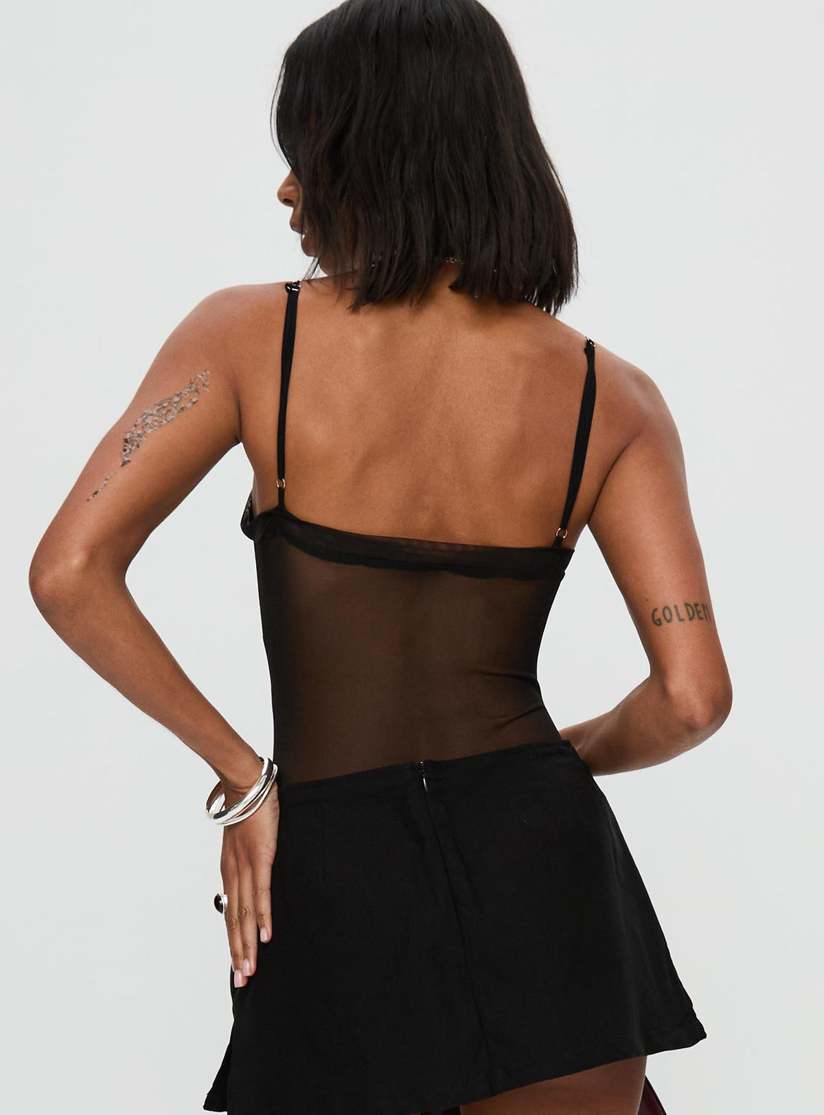 back view of model wearing Princess Polly In The Club Bodysuit Black Sleeveless Bodysuit 