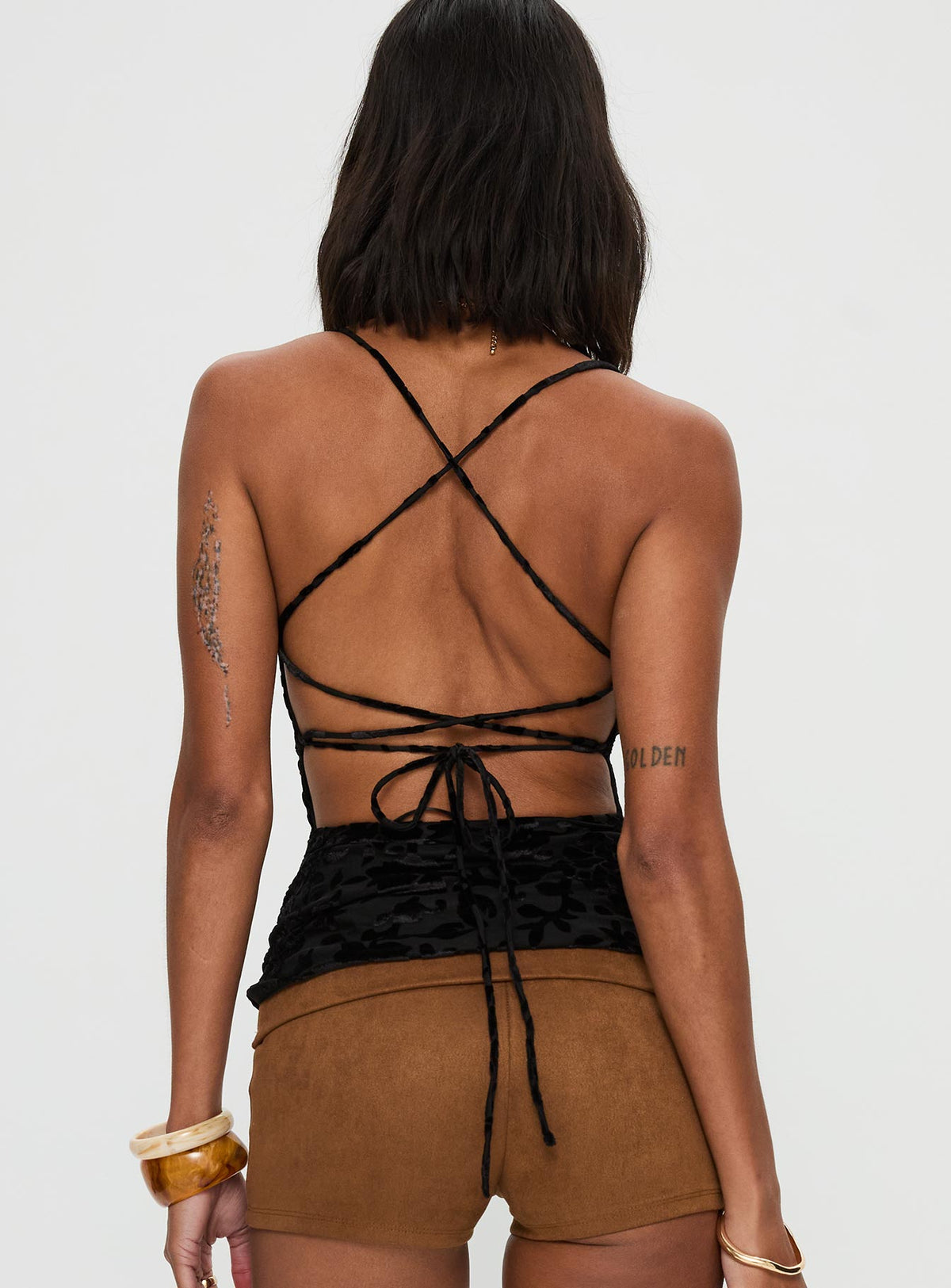 back view of model wearing Princess Polly Celena Halter Top Black Sleeveless Cowl 