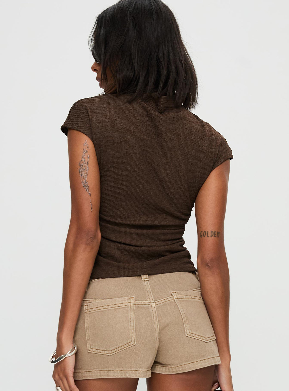 back view of model wearing Princess Polly Make A Plan Top Brown Short Sleeves High Neck 
