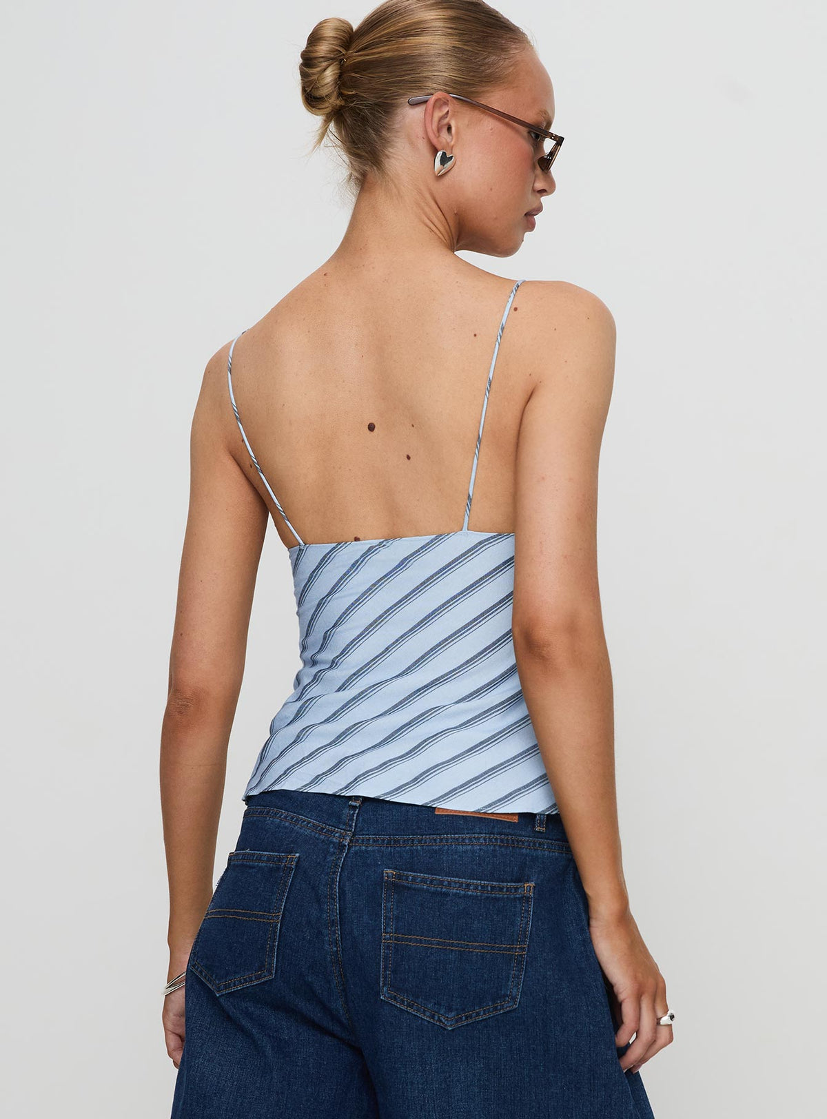 back view of model wearing Princess Polly Mariah Top Blue Stripe Sleeveless Plunger 