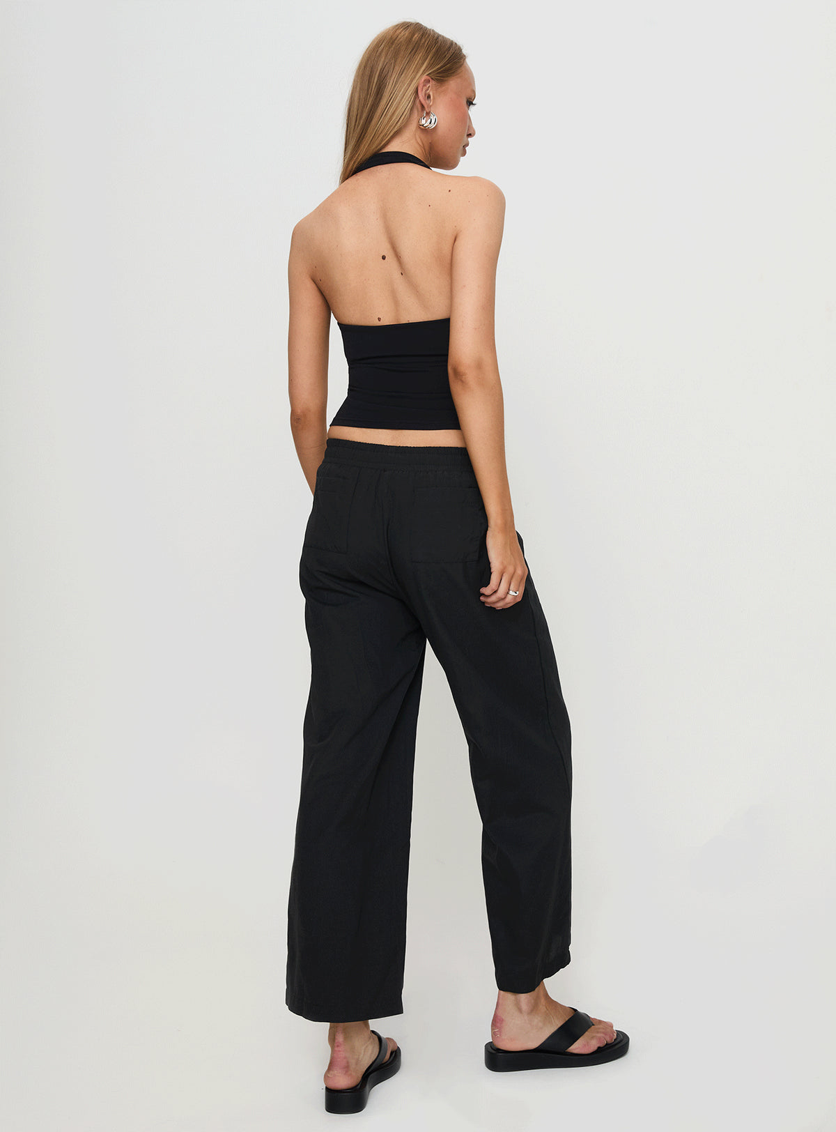 back view of model wearing Princess Polly Beach House Pants Black Low Rise Pants Pants 