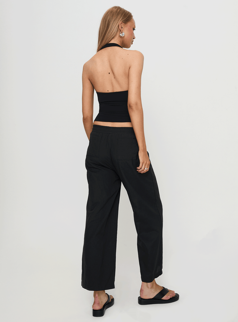 back view of model wearing Princess Polly Beach House Pants Black Low Rise Pants Pants 