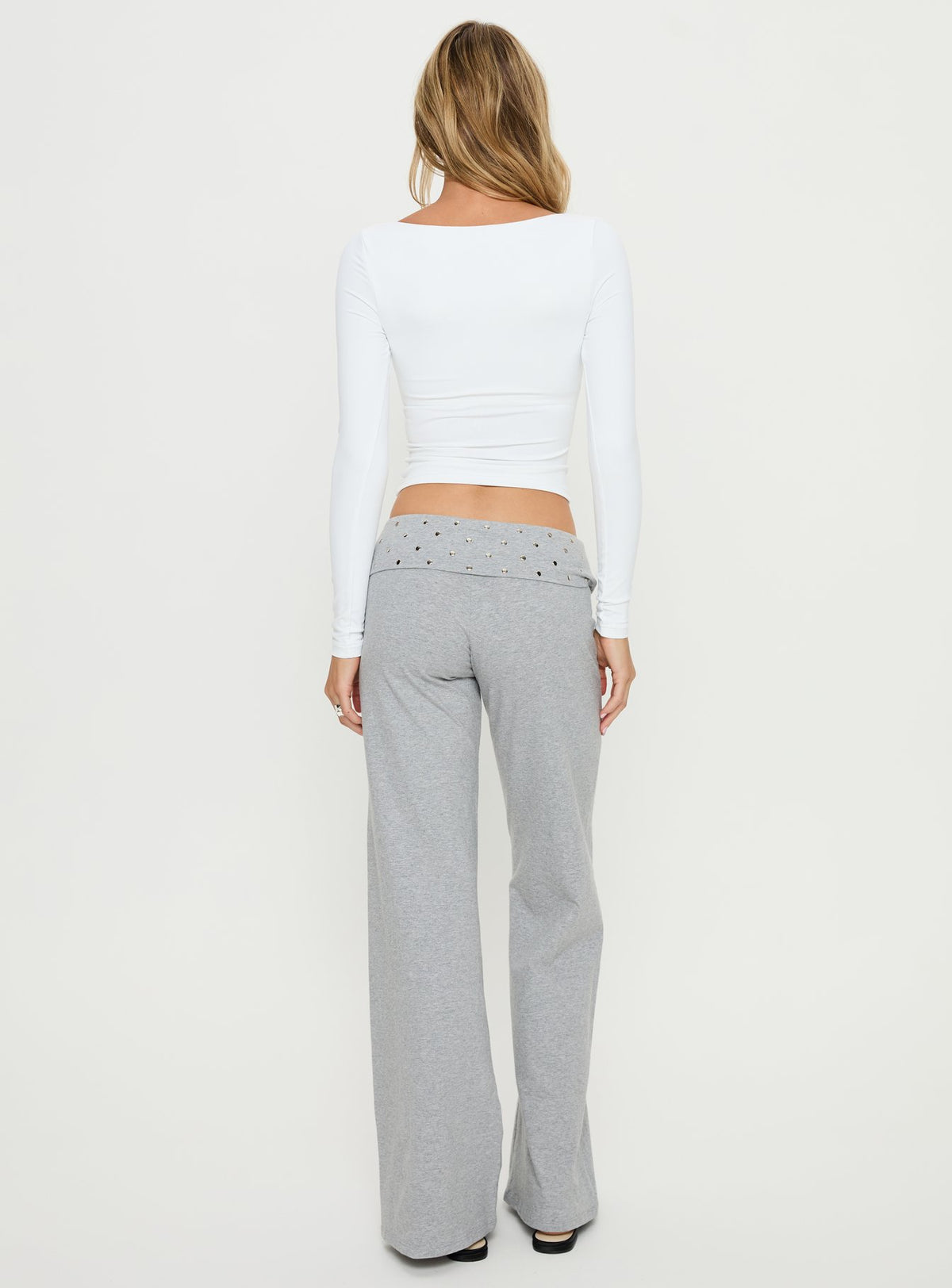 Styled in Nevivi Foldover Studded Pants Grey Marle womens-regular-pants with high-rise waist back view of model wearing Princess Polly