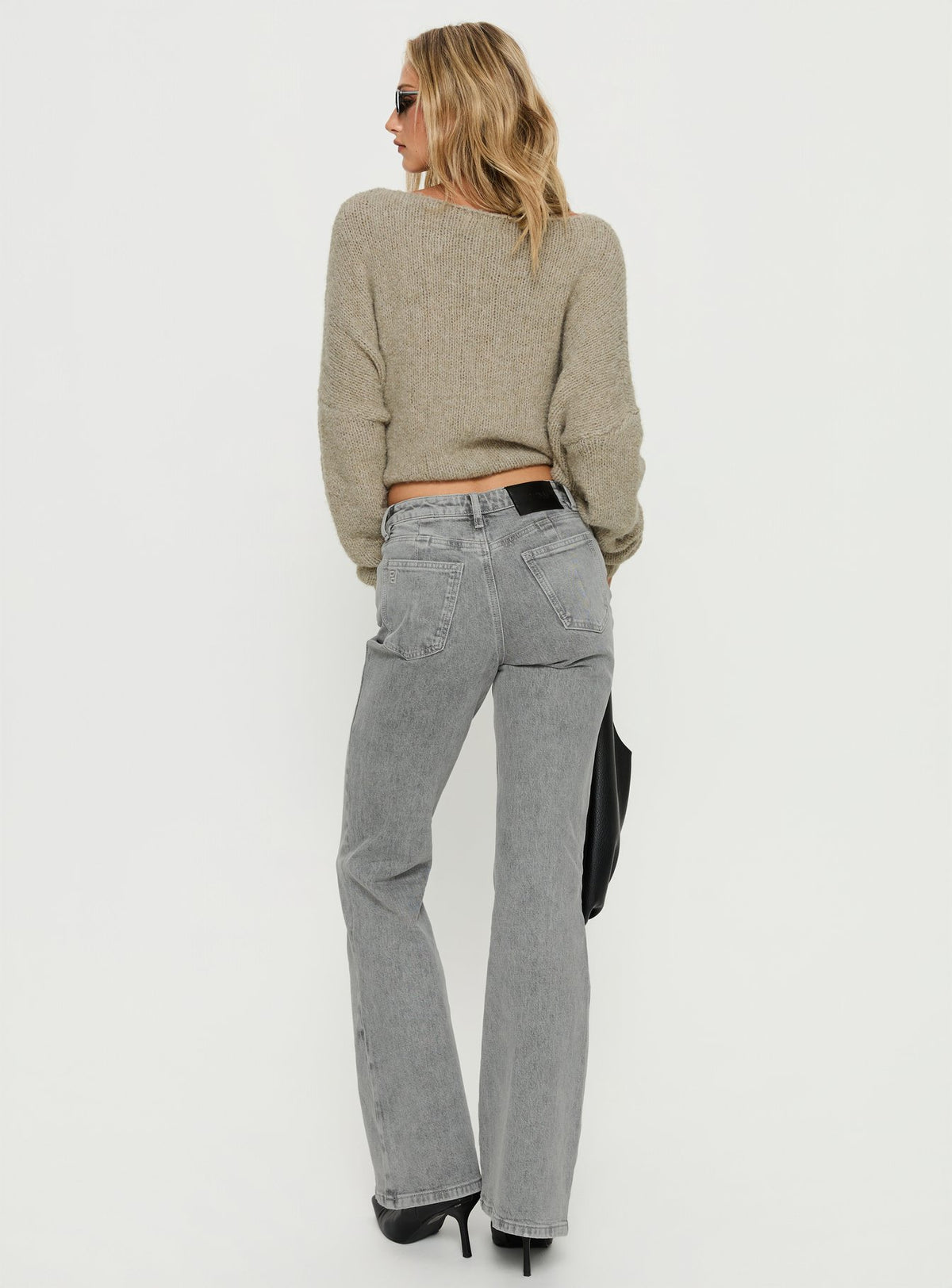 back view of model wearing Princess Polly Magic Mirror Mid Rise Bootleg Jeans Washed Grey Mid Rise Jeans Jeans 