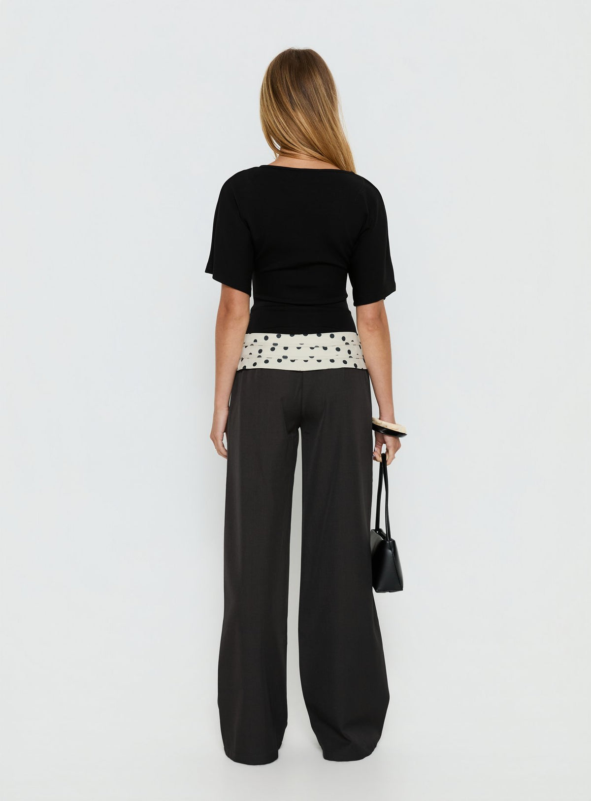 back view of model wearing Princess Polly Seneca Wrap Pants Charcoal Polka Dot Mid Rise Pants Pants 