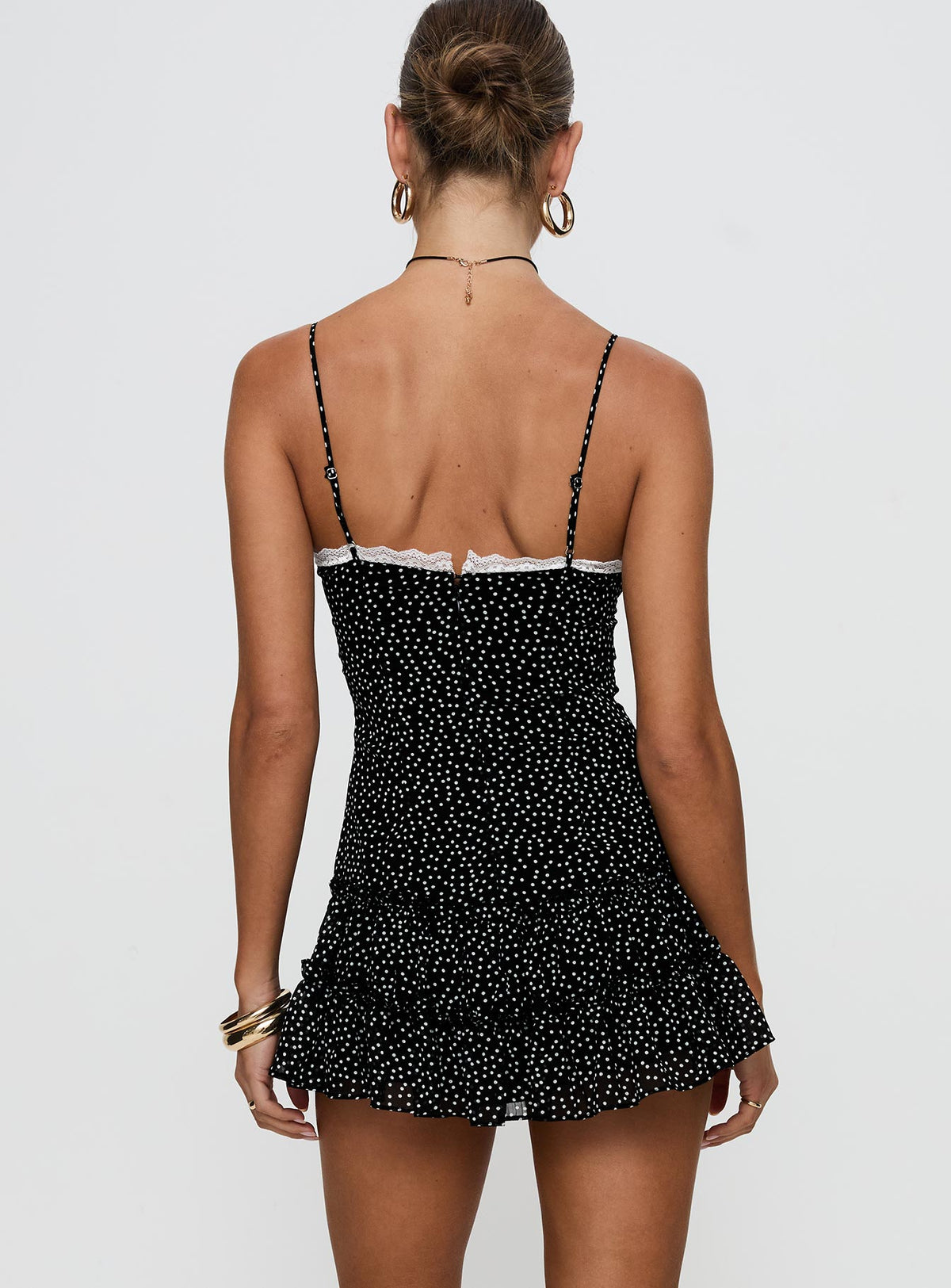 back view of model wearing Princess Polly Yves Mini Dress Onyx Polka Scoop Neck 