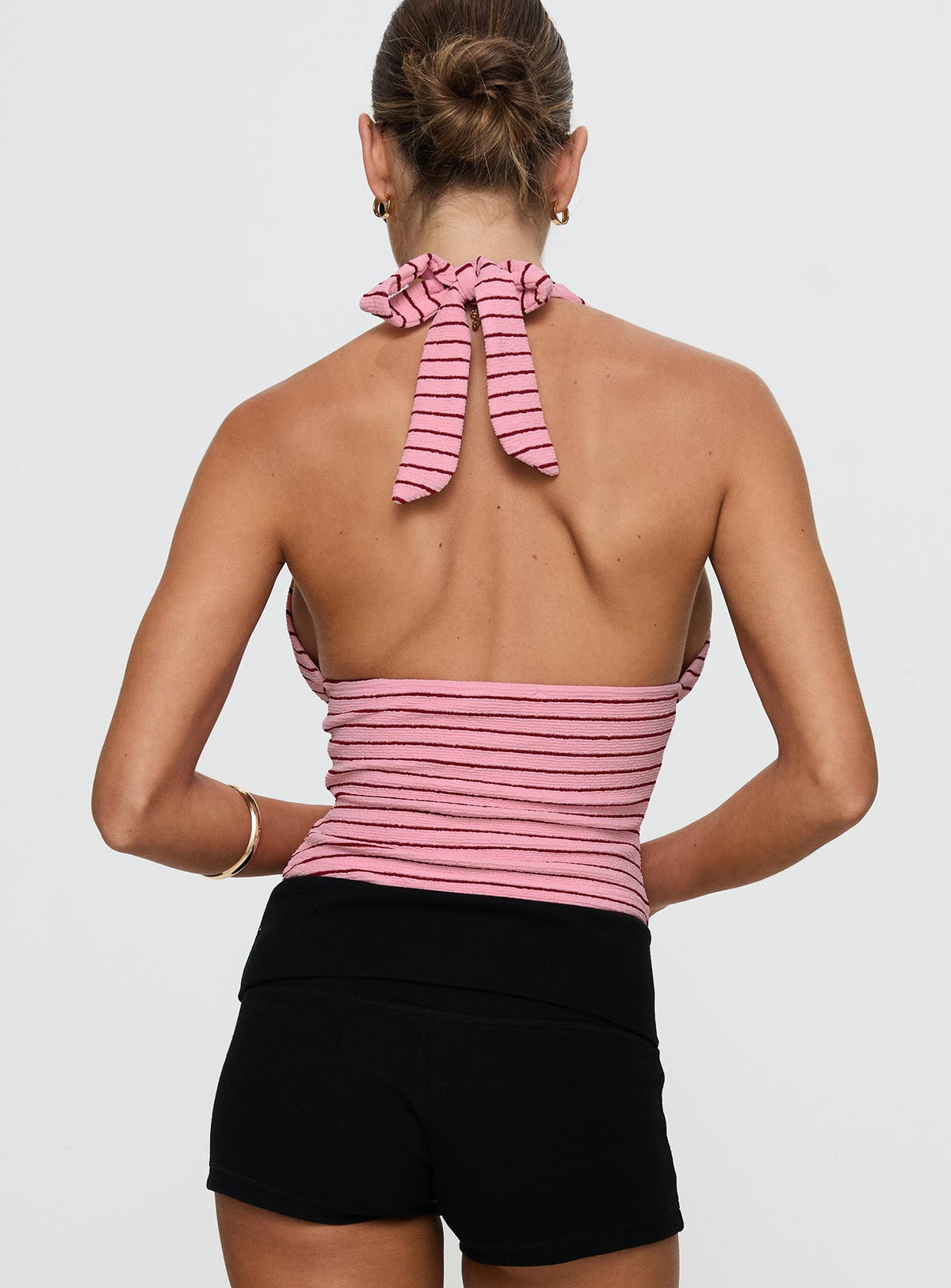 back view of model wearing Princess Polly Whimsy Halter Top Pink / Red Stripe Sleeveless Plunger 