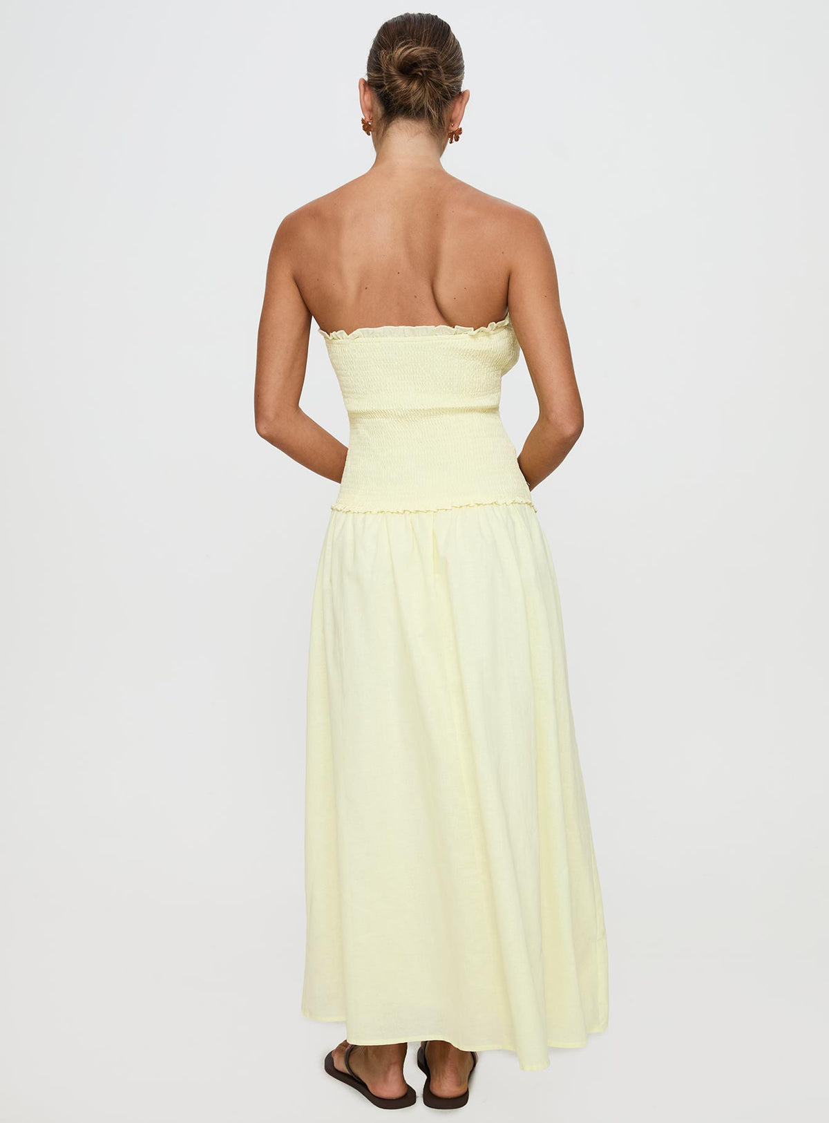 back view of model wearing Princess Polly Tinsie Strapless Maxi Dress Yellow Straight Neck 