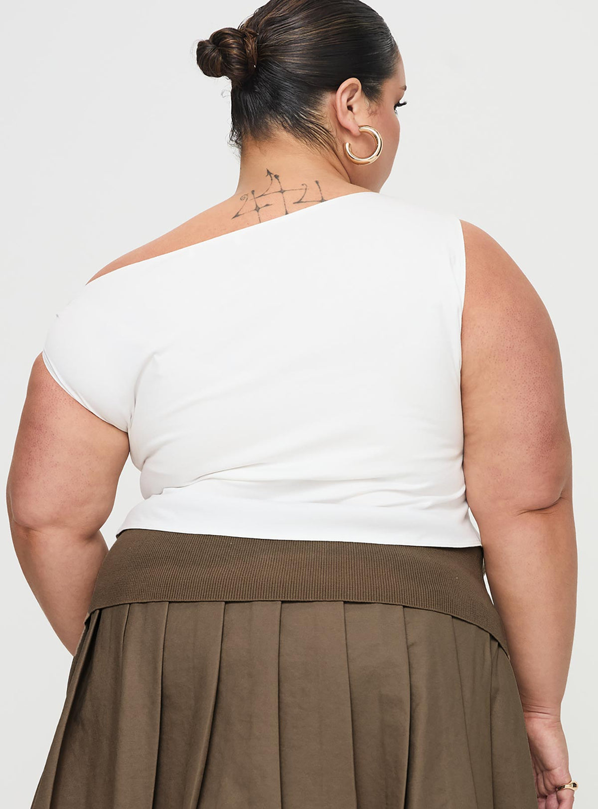 back view of model wearing Princess Polly Karre Off The Shoulder Top White Curve Short Sleeves Asymmetric Neckline 