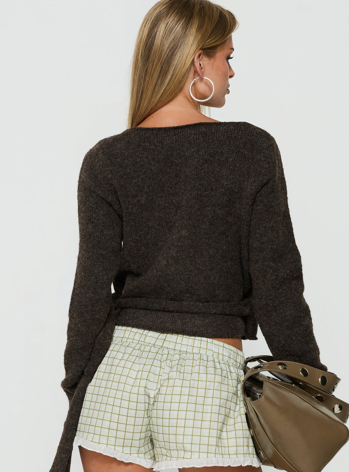 Presenting the Tonee Wrap Knit Cardigan in Chocolate womens jumpers with short length back view of model wearing Princess Polly