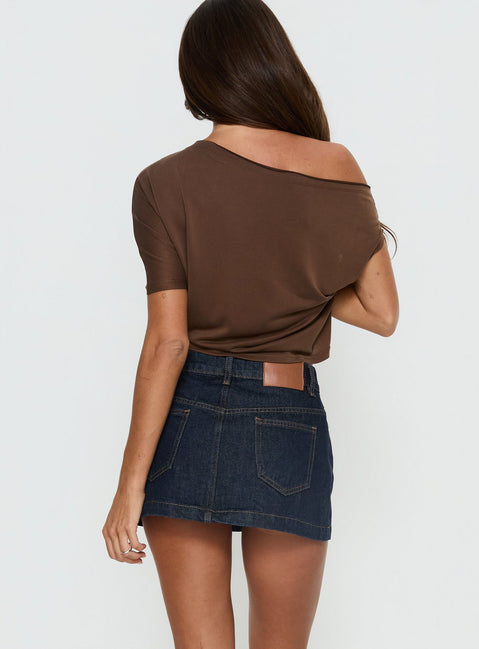 back view of model wearing Princess Polly Nicolina Low Rise Denim Mini Skirt Raw Denim Mini Skirts Skirts 
