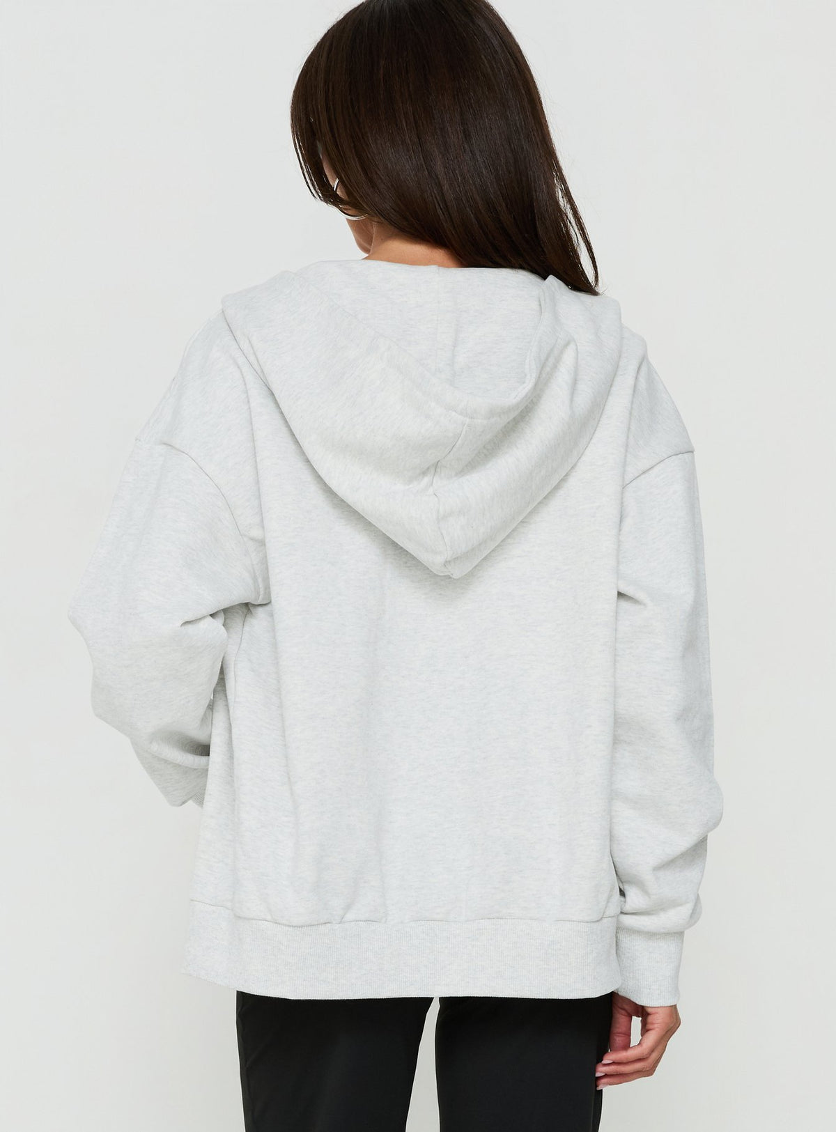Crafted from quality fabric, the All Day Studded Oversized Hoodie Grey Marle womens-jumpers with short length back view of model wearing Princess Polly