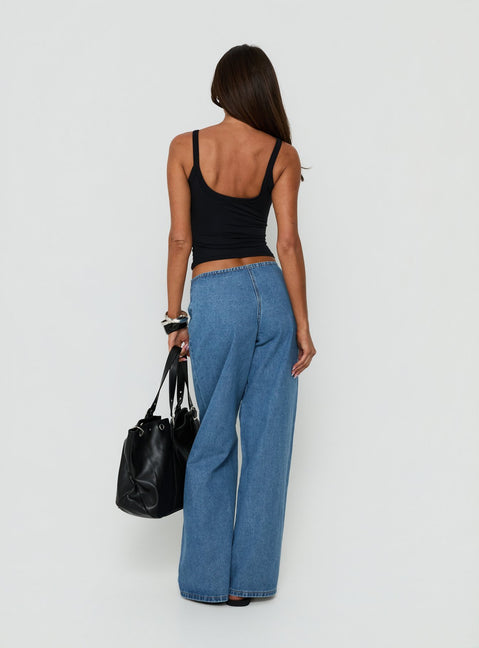 Displaying the Hereos Mid Rise Baggy Leg Jeans in Bright Blue Wash, womens jeans with mid-rise waist and belt detail, back view of model wearing Princess Polly