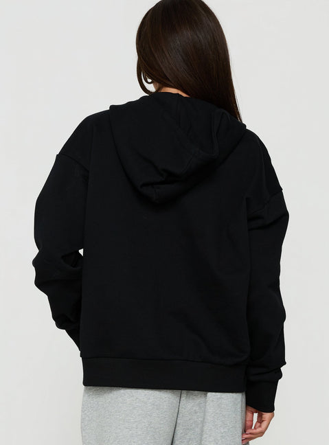 Shop the All Day Studded Oversized Hoodie Black womens-jumpers in short length back view of model wearing Princess Polly