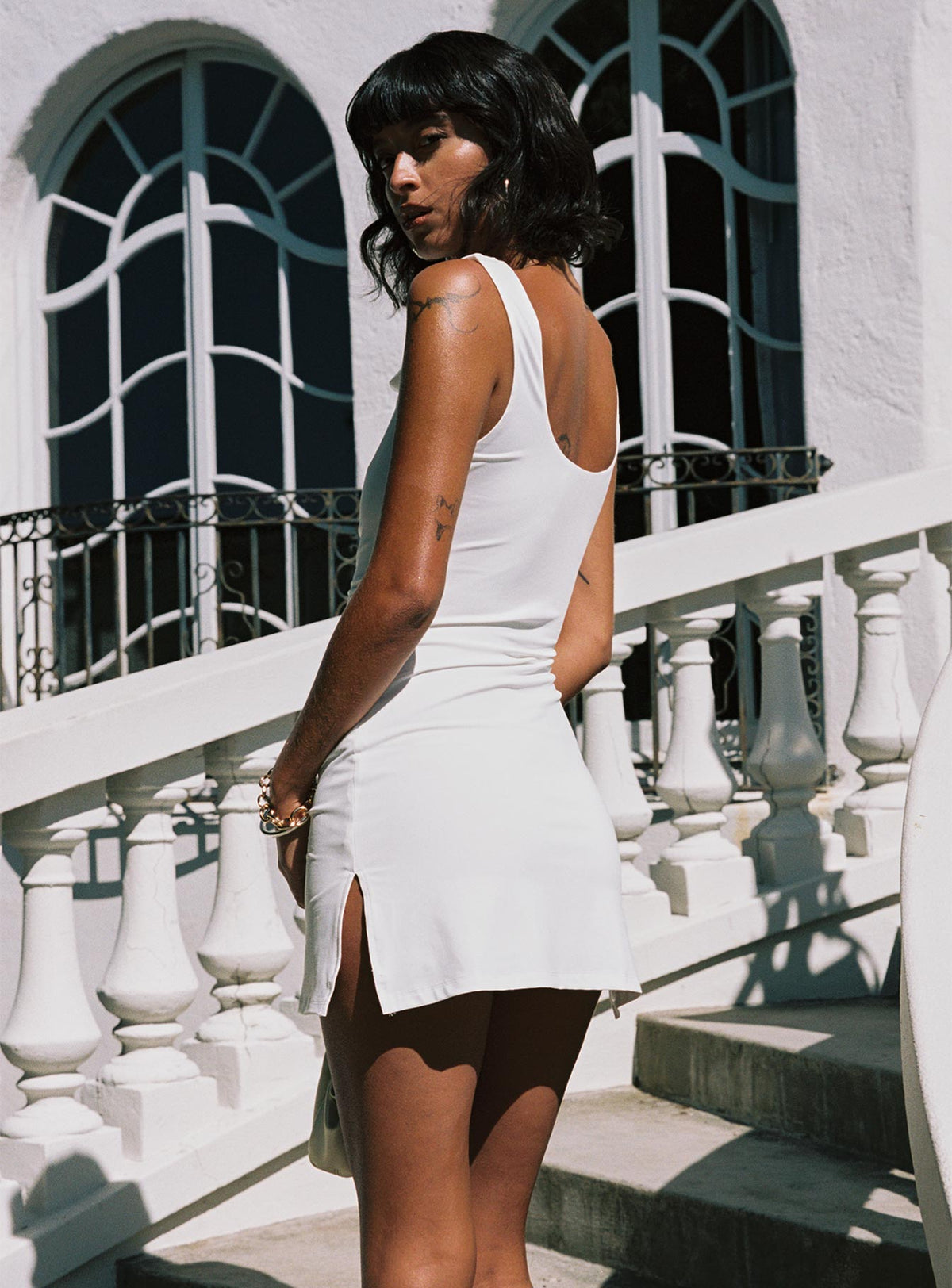 side view of model wearing Princess Polly Renault Mini Dress White Cowl Neck 