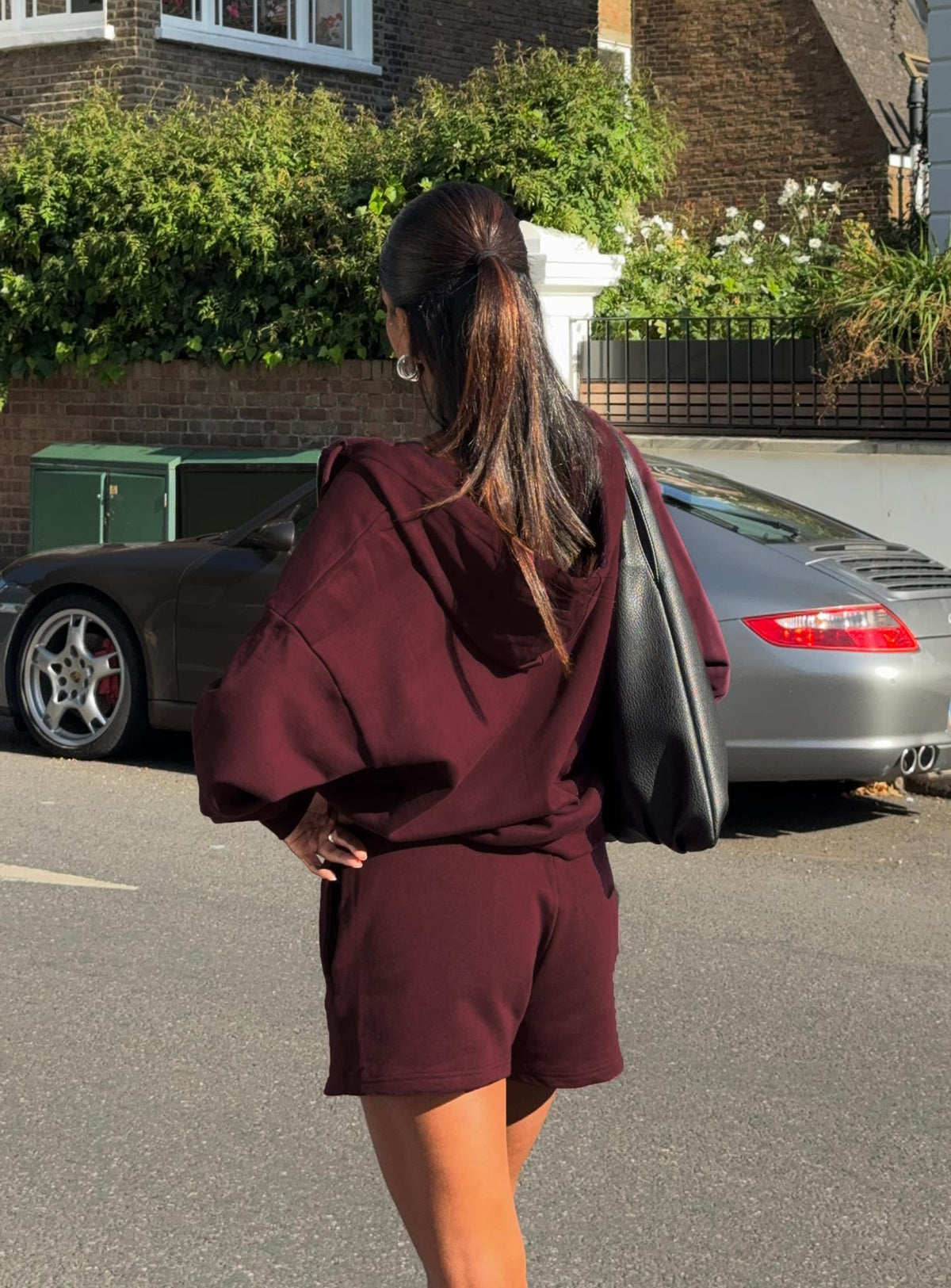 back view of model wearing Princess Polly All Day Short Wine High Waisted Shorts 