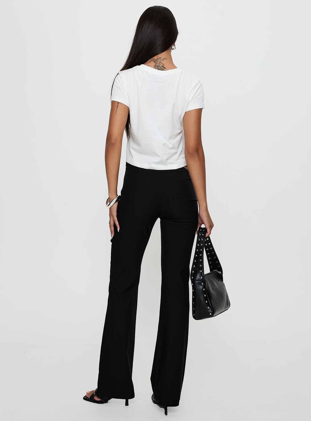 back view of model wearing Princess Polly Eyes On You Flare Pants Black High Rise Pants Pants 