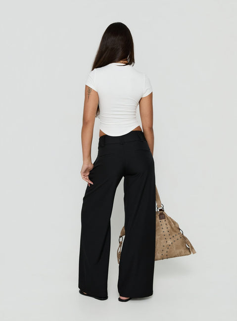 Designed with the Loved Up Low Rise Baggy Pants Black Tall in womens-regular-pants featuring low-rise waist back view of model wearing Princess Polly