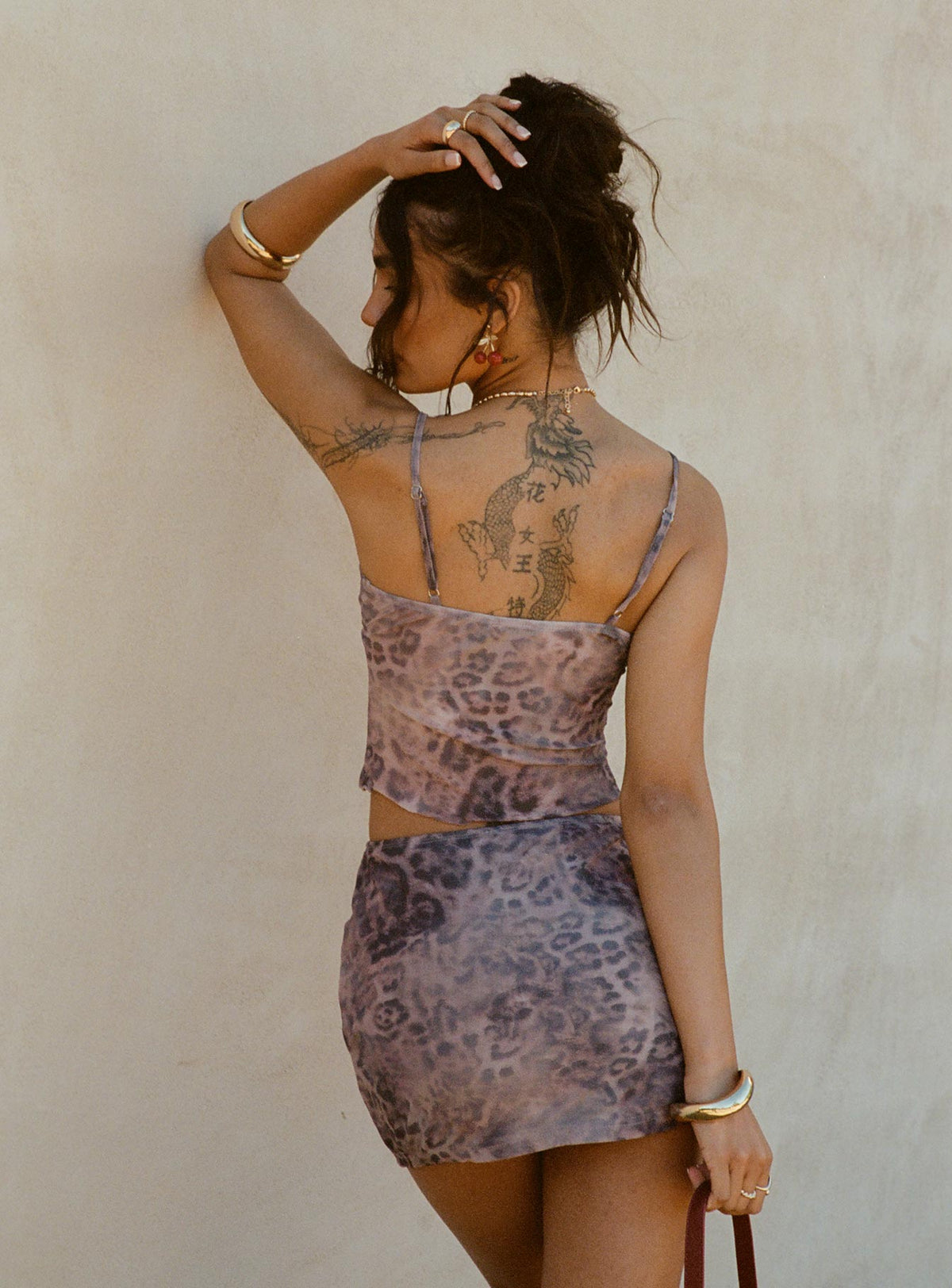 back view of model wearing Princess Polly Eustacia Mini Skirt Leopard Mini Skirts Skirts 