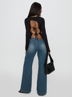 back view of model wearing Princess Polly Laguardia Mid Rise Wide Leg Jeans Dark Blue Wash Mid Rise Jeans Jeans 