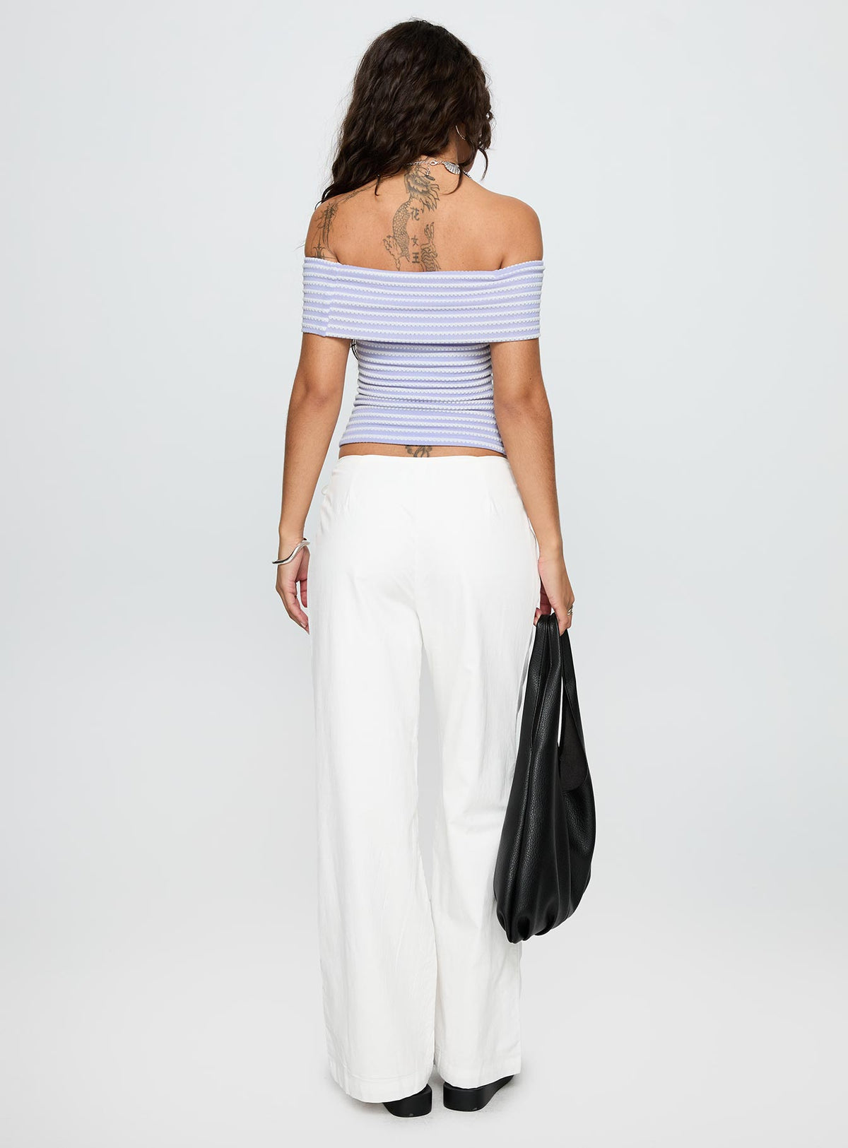 back view of model wearing Princess Polly Leyah Tie Side Pants White Low Rise Pants Pants 