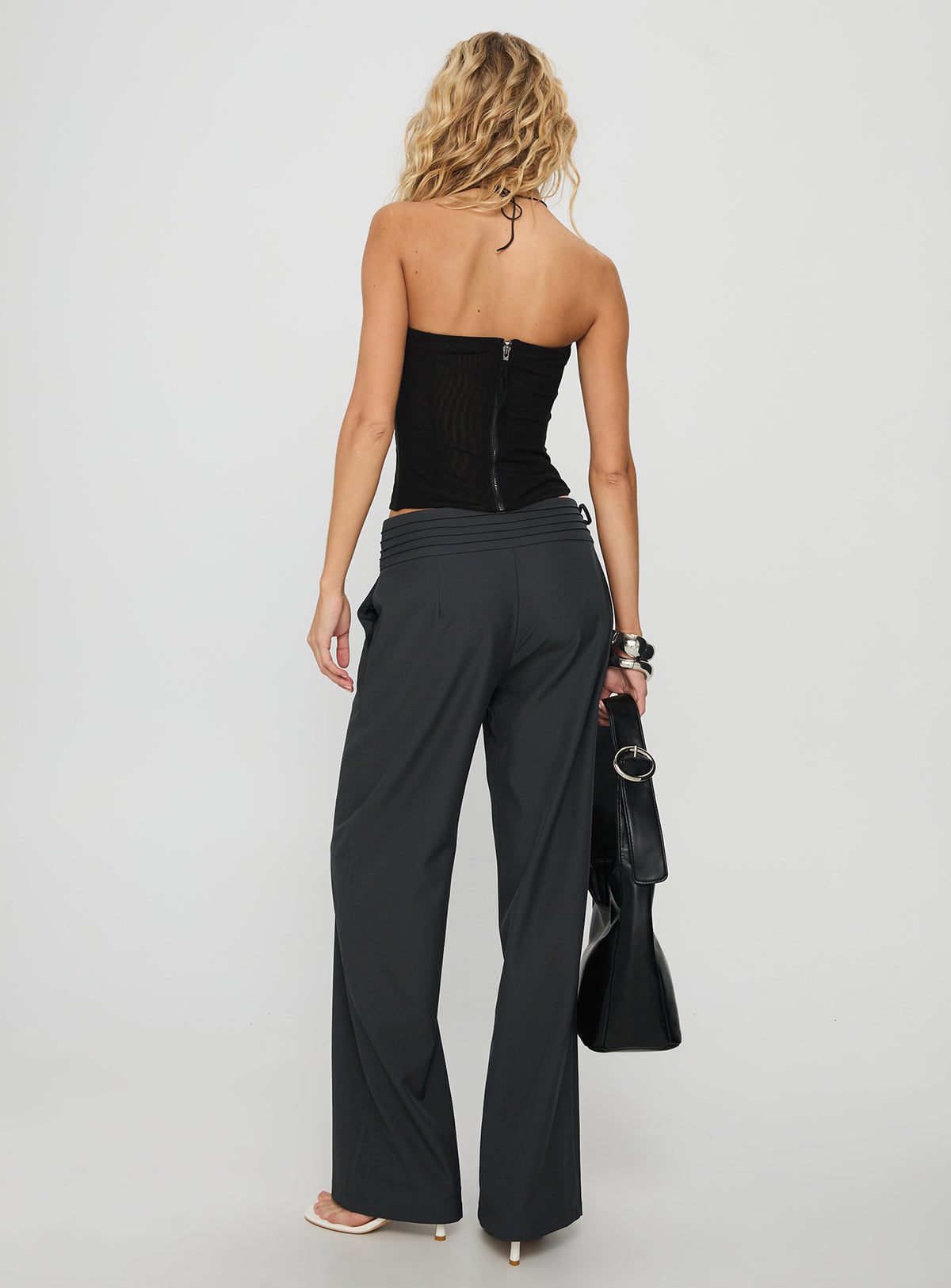 Crafted from Good Riddance Pleat Tie Slouch Pants Charcoal Petite womens-regular-pants featuring mid-rise waist back view of model wearing Princess Polly