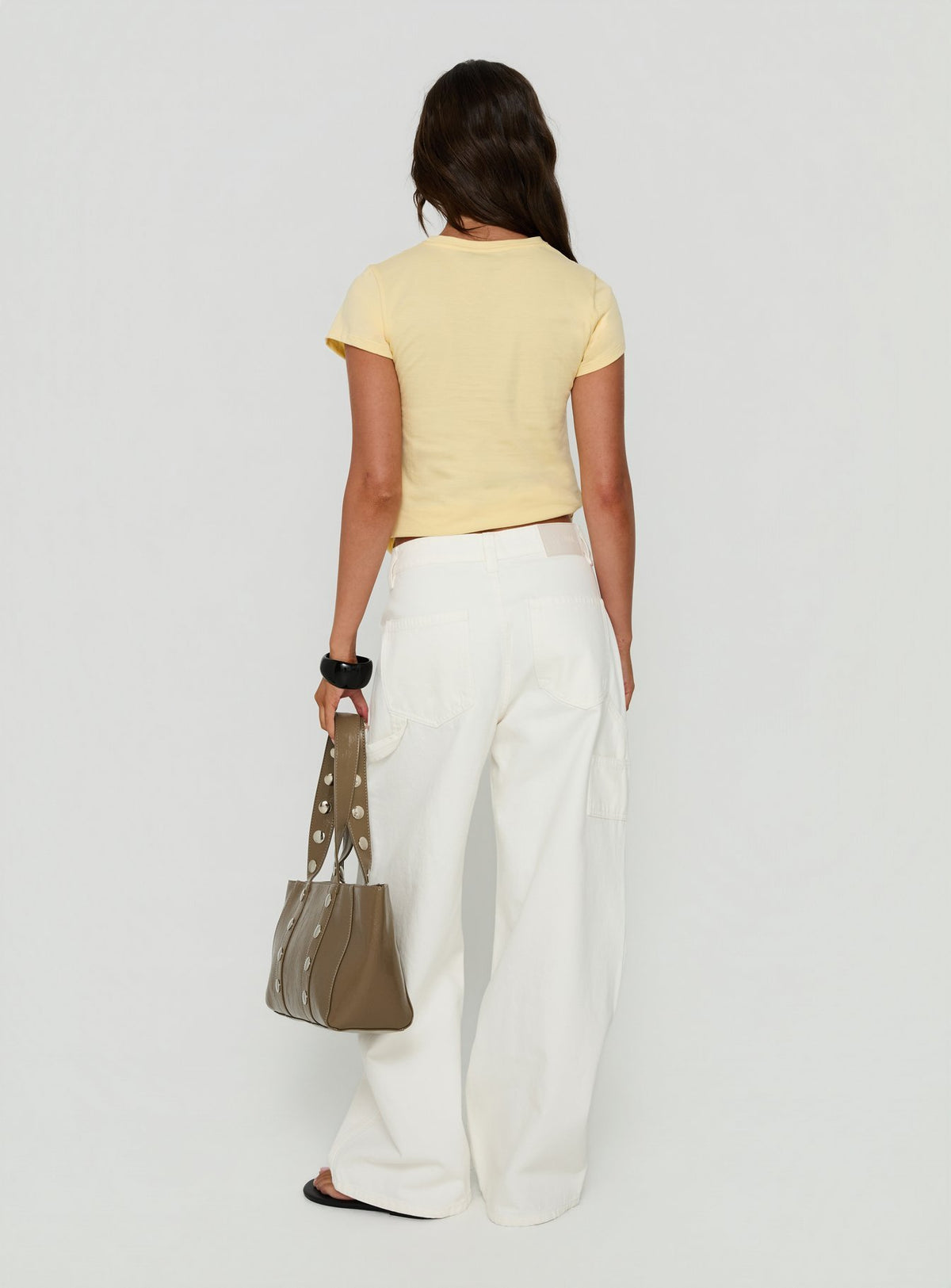 Experience Mistree Mid Rise Baggy Cargo Jeans White in womens-jeans with mid-rise back view of model wearing Princess Polly
