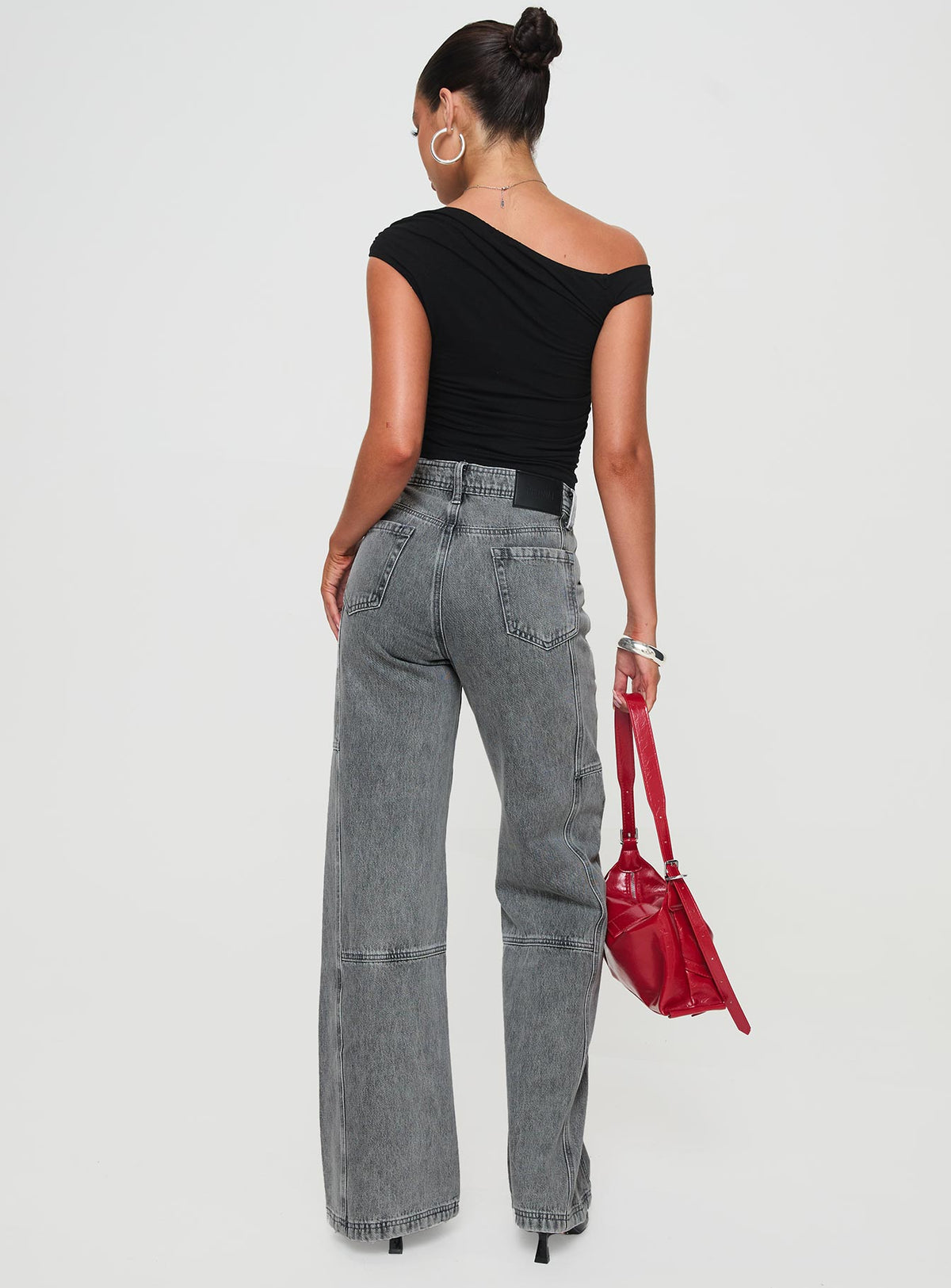 back view of model wearing Princess Polly Chad High Rise Flared Cargo Jeans Washed Grey Mid Rise Jeans Jeans 