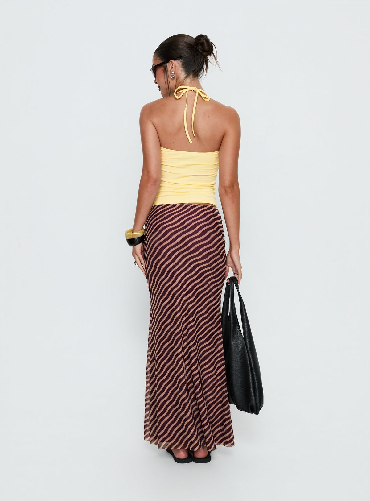 back view of model wearing Princess Polly Caviar Tie Maxi Skirt Brown Stripe Maxi Skirts Skirts 