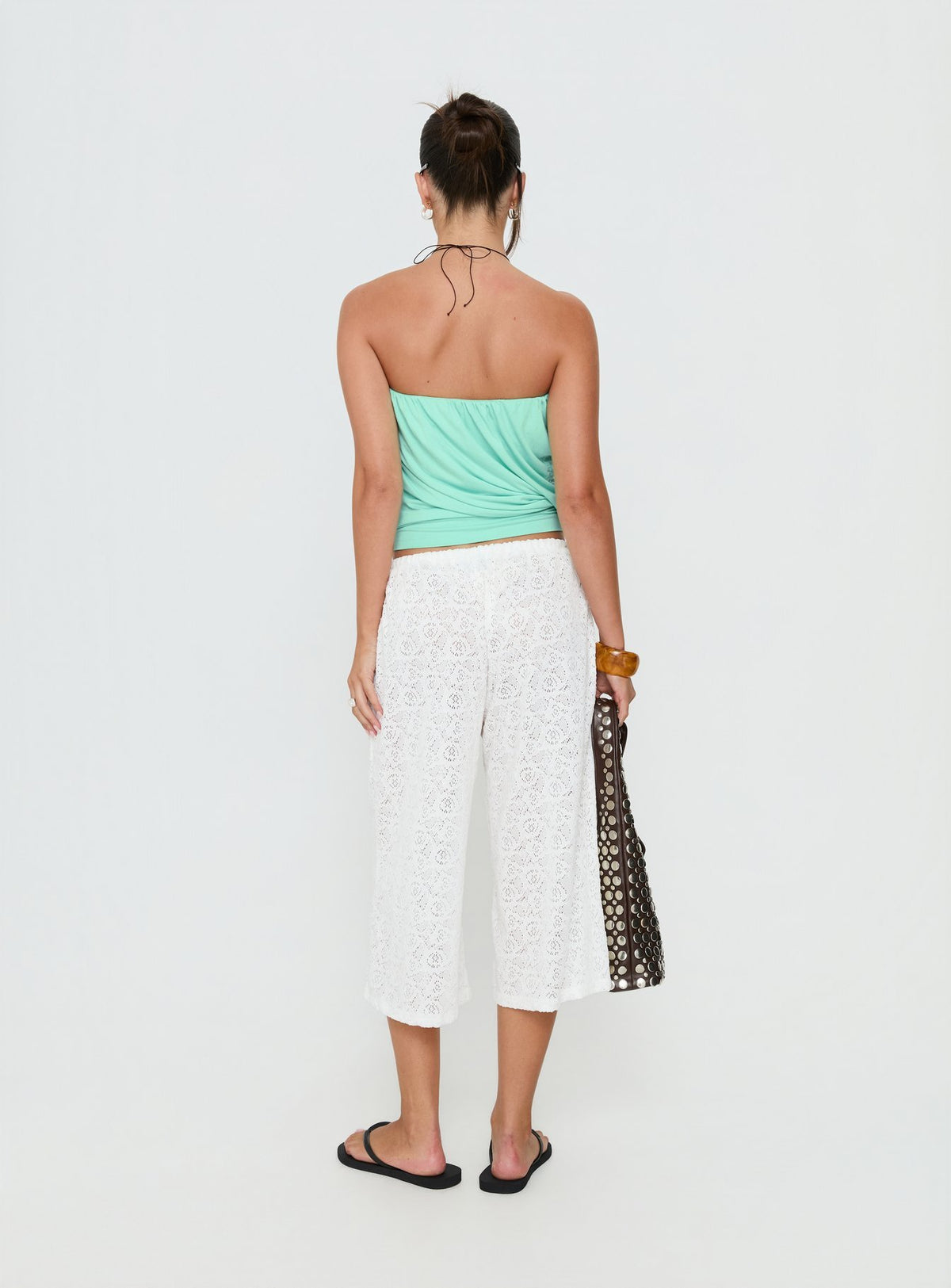Crafted with the Kiss Me Quick 3/4 Lace Drawstring Pants White in womens regular pants with mid-rise waist back view of model wearing Princess Polly