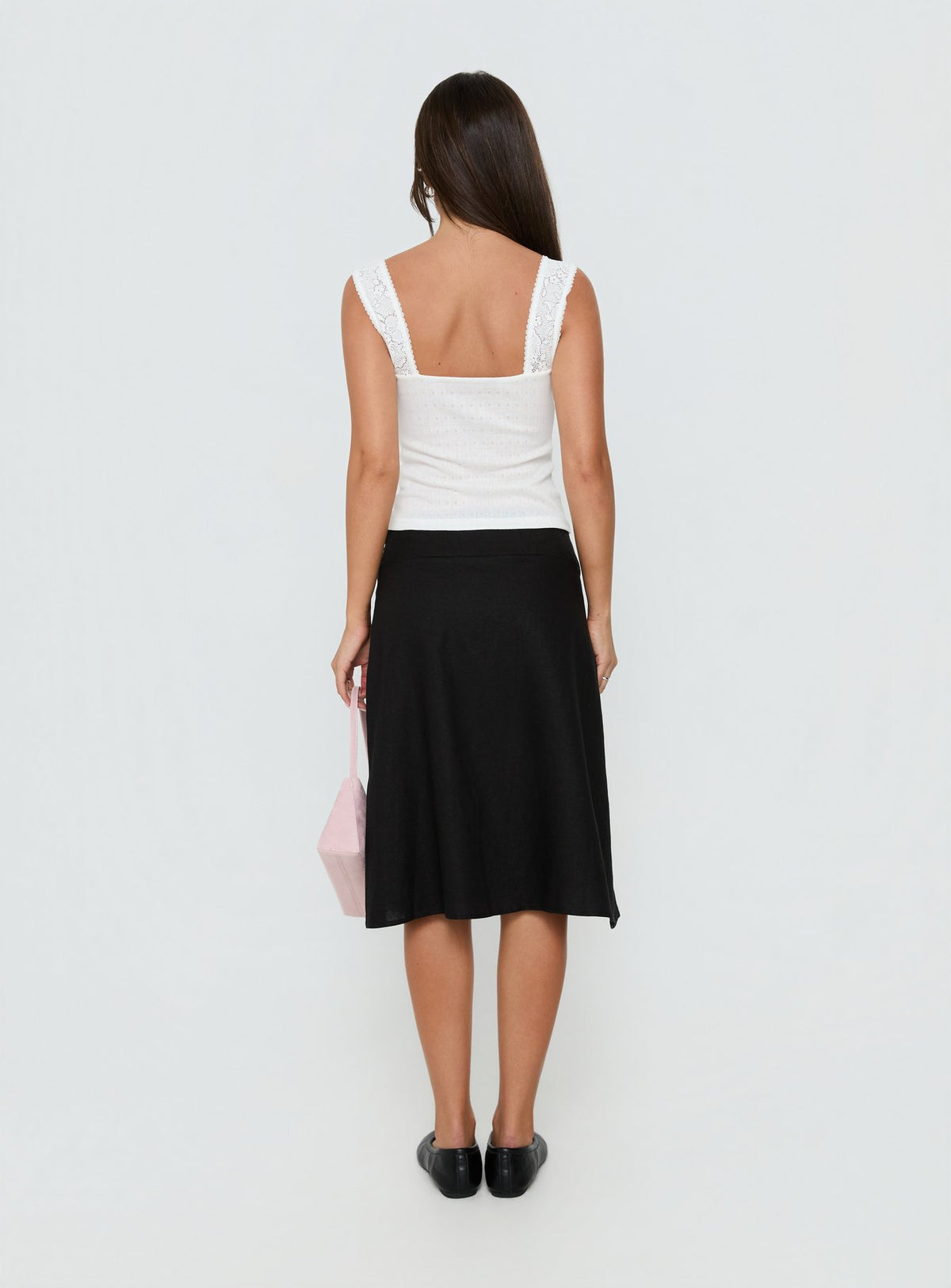 Displaying the Such Delight Linen Midi Skirt Black womens-skirts in relaxed aline fit back view of model wearing