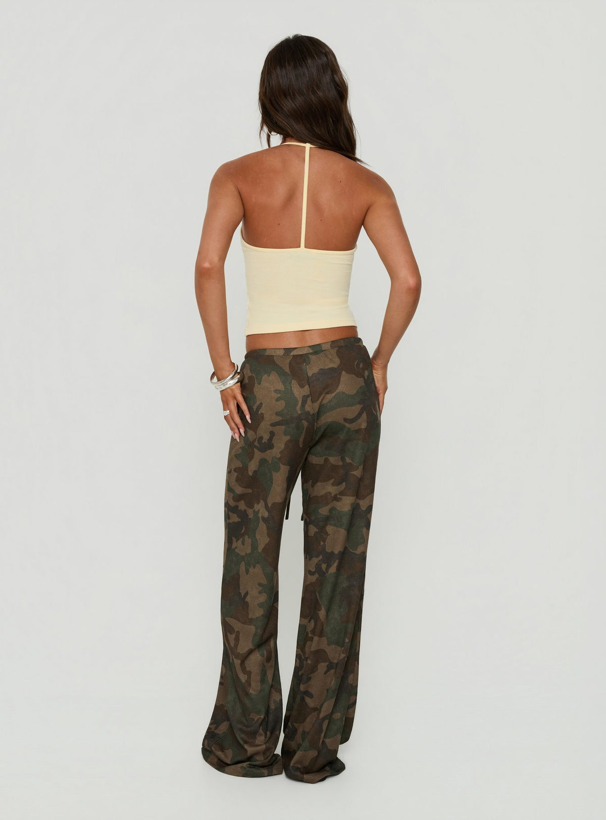 Highlighting the Seylah Waffle Jersey Pants in camo print, womens regular mid-rise wide-leg style, back view of model wearing