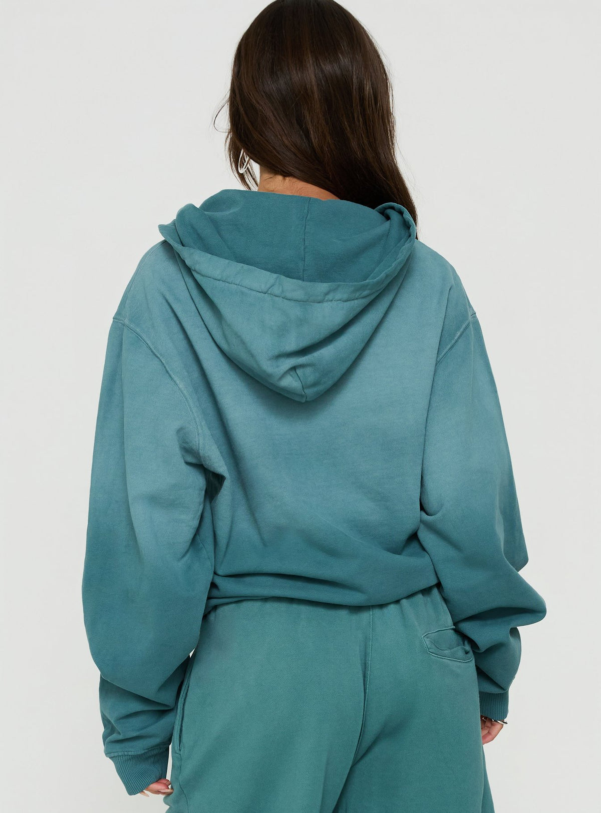 Browse the AT Zip Through Oversized Hoodie in Washed Teal womens-jumpers with short length back view of model wearing Princess Polly