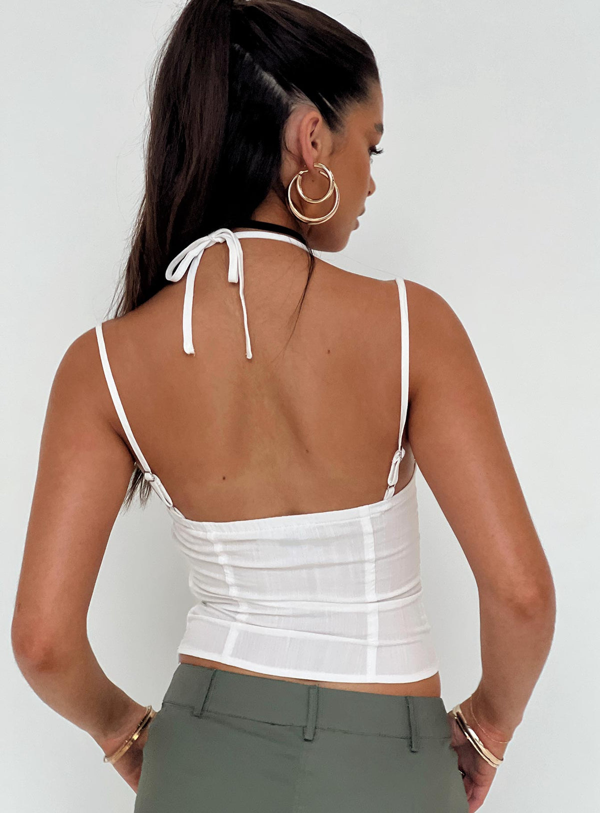 Front view of model wearing  front Princess Polly Sleeveless Square Neck  Trynia Top White