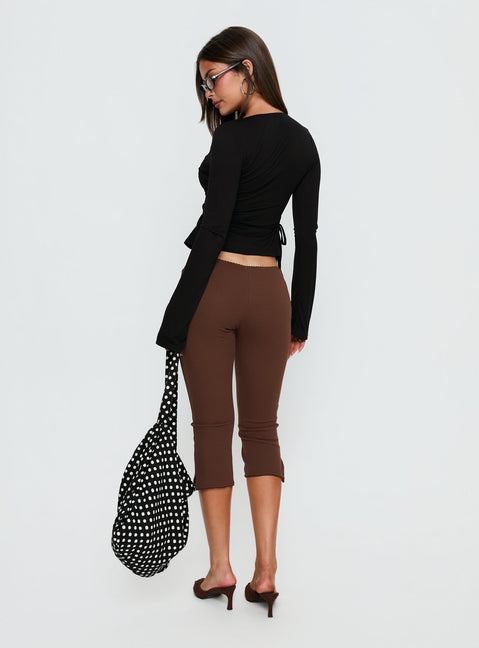 Explore the Baseline Rib Capri Pants Chocolate in womens-regular-pants with high-rise back view of model wearing