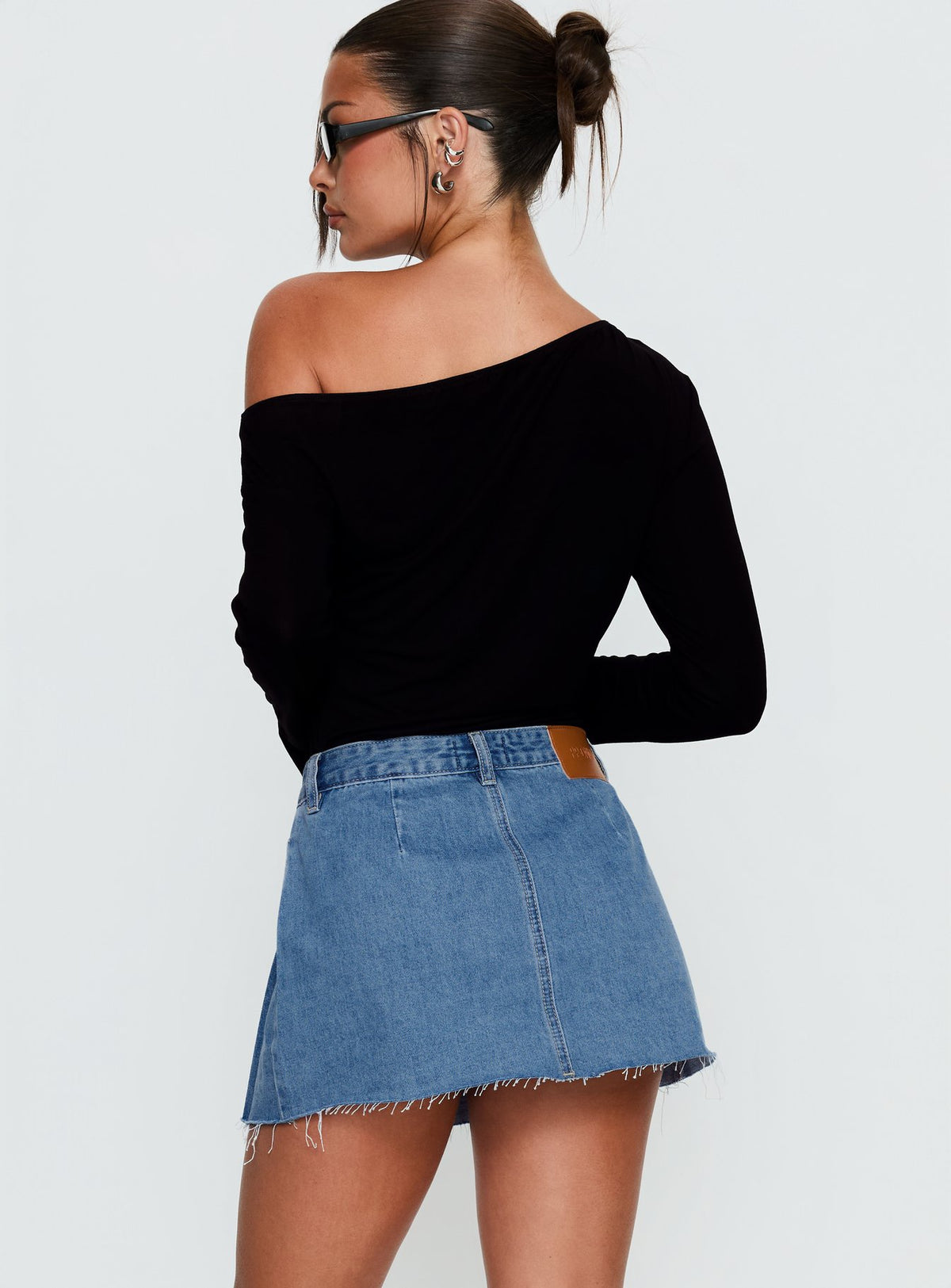 back view of model wearing Princess Polly Debera Pleated Mini Skirt Mid Blue Wash Skirts 