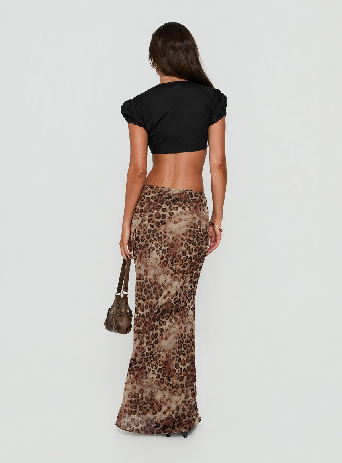 Introducing the Eliena Maxi Skirt Leopard in womens-skirts with maxi length back view of model wearing