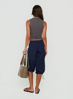 Explore the Riyah 3/4 Low Rise Nylon Pants Navy in womens-regular-pants featuring stripe details back view of model wearing Princess Polly