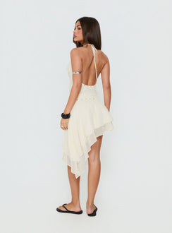 Showcasing the Gemmina Asymmetrical Chiffon Mini Skirt Cream womens-skirts in relaxed fit with mini length back view of model wearing Princess Polly
