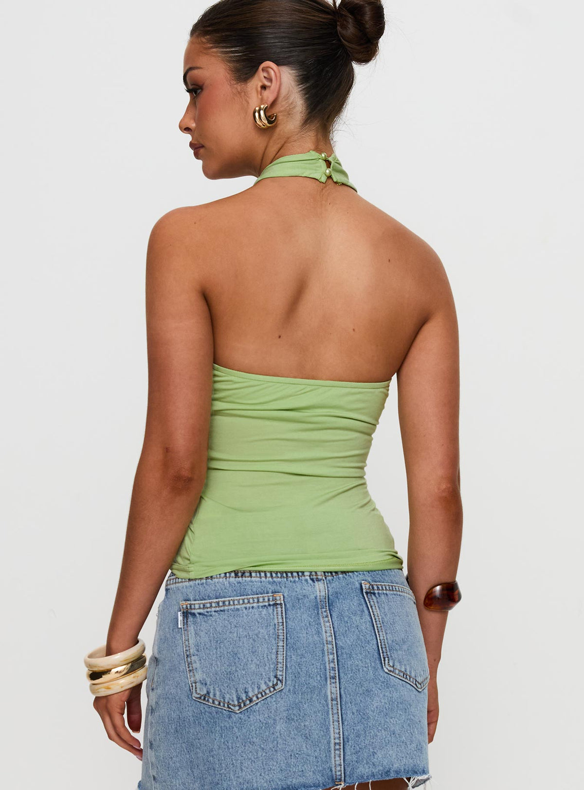 back view of model wearing Princess Polly Quell Top Green Sleeveless High Neck 