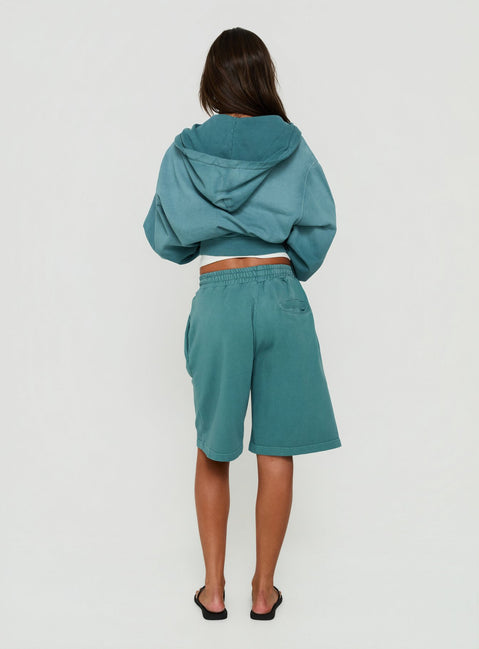 Featuring the AT Fleece Baggy Jort in Washed Teal womens regular pants with mid-rise back view of model wearing Princess Polly