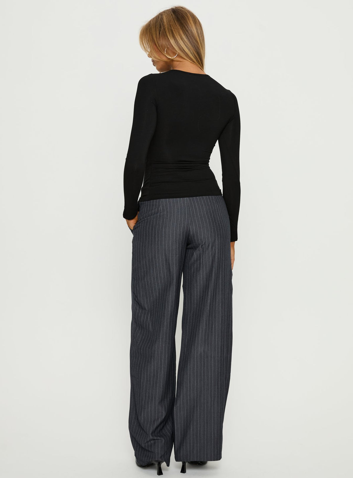 back view of model wearing Princess Polly Khane Low Rise Wide Leg Pant Charcoal Pinstripe Mid Rise Pants Pants 