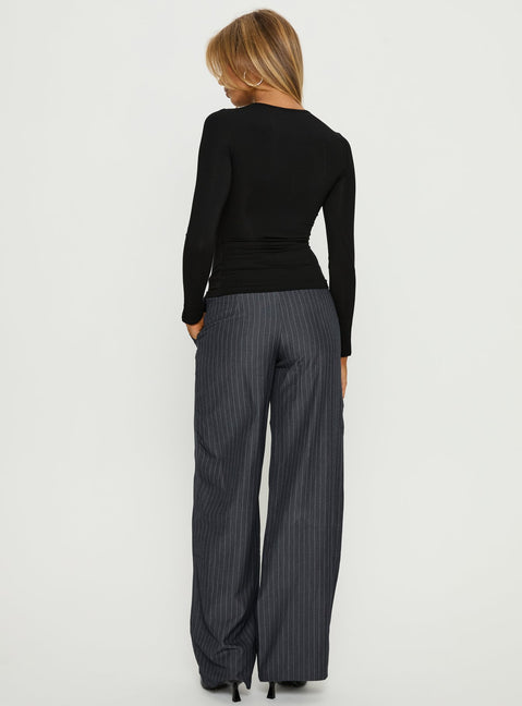 back view of model wearing Princess Polly Khane Low Rise Wide Leg Pant Charcoal Pinstripe Mid Rise Pants Pants 