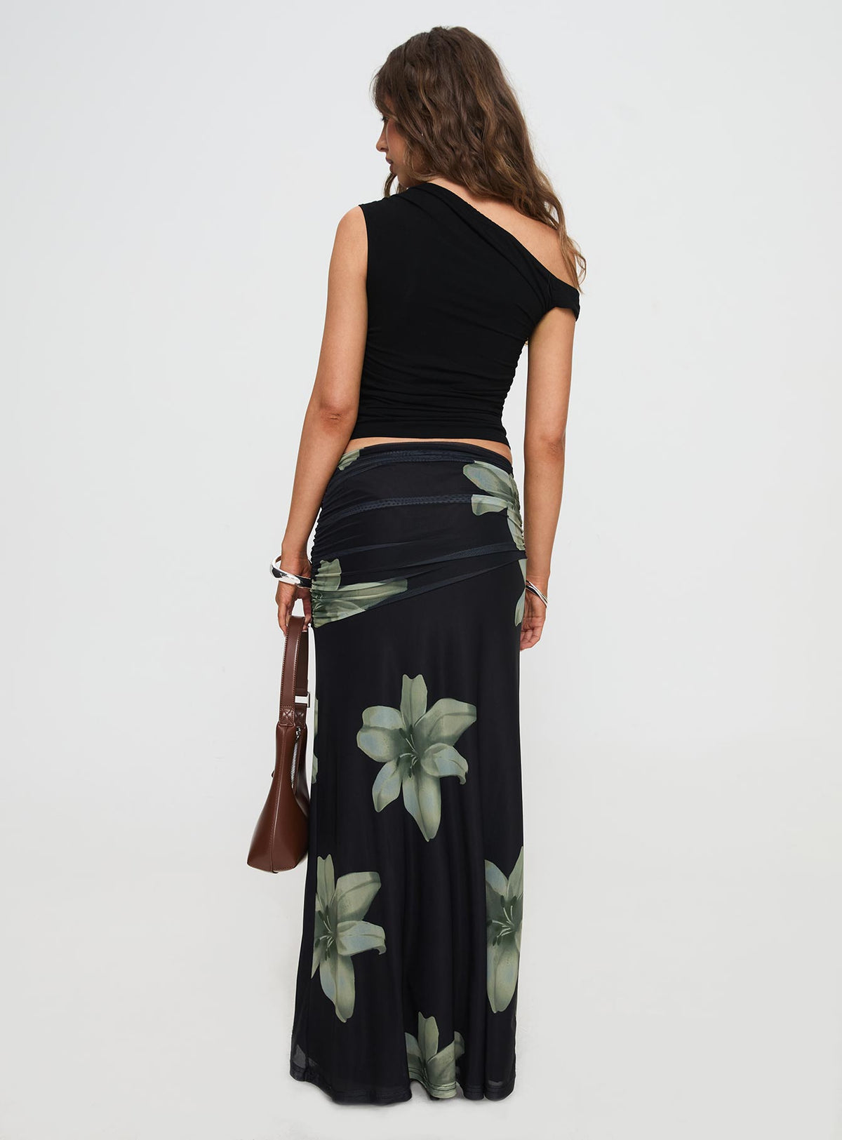 back view of model wearing Princess Polly Cooperi Maxi Skirt Black Floral Maxi Skirts Skirts 