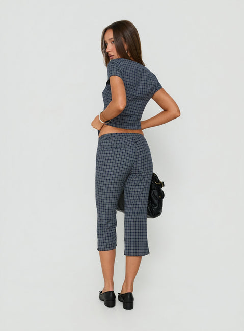 Displaying the Mayvie Capri Pants Navy Check in womens regular pants with high-rise waist back view of model wearing