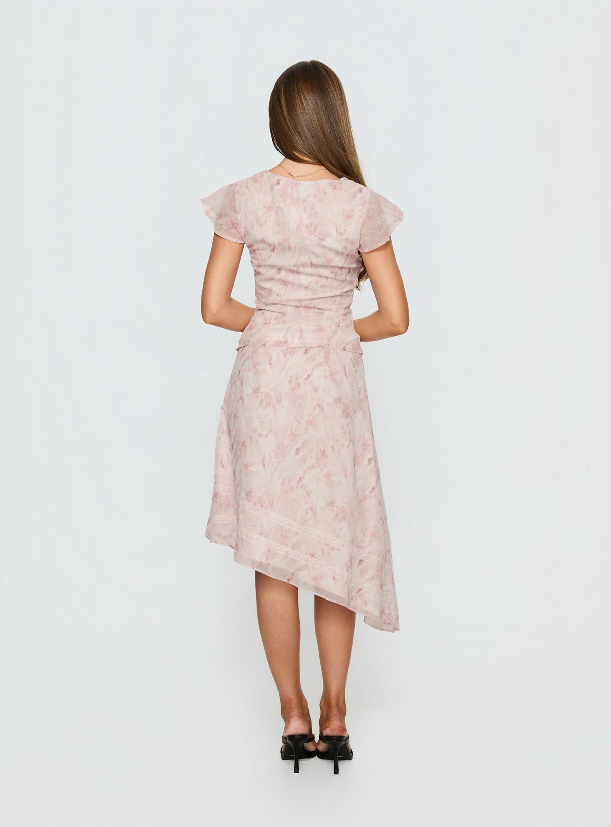 back view of model wearing Princess Polly Avaline Asymmetrical Midi Skirt Pink Skirts 