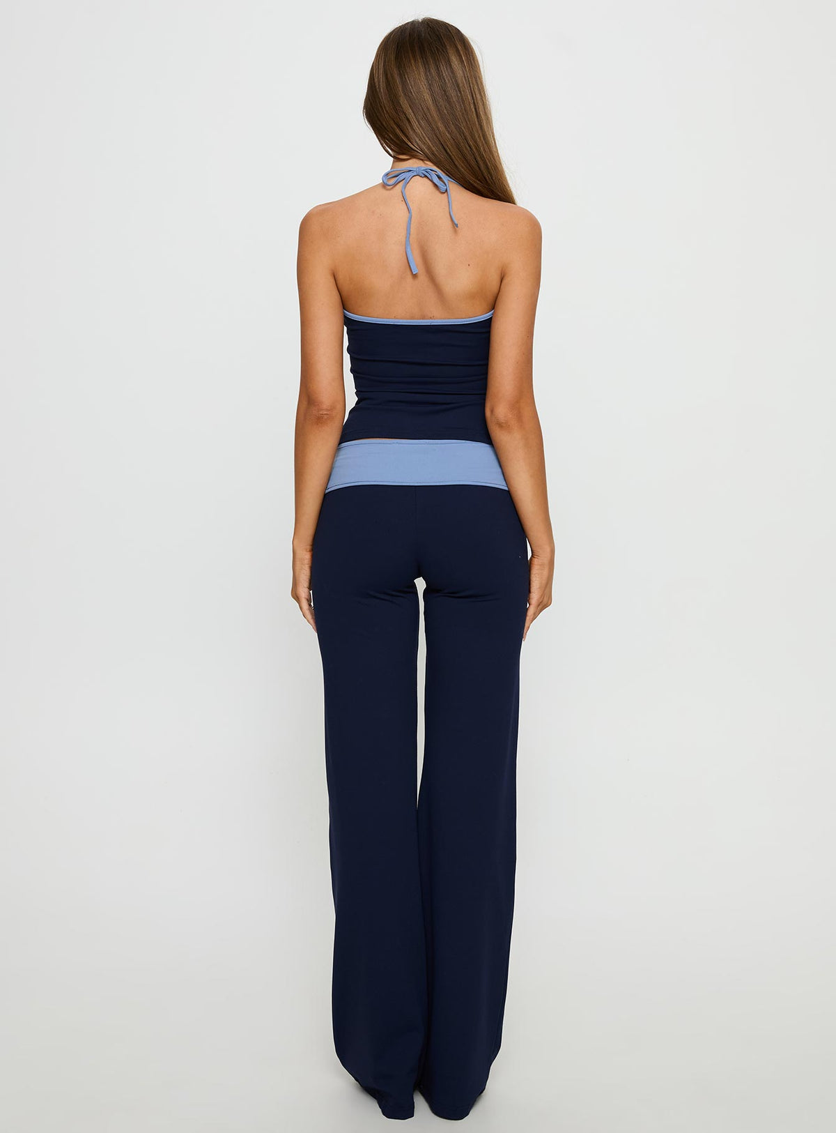back view of model wearing Princess Polly Kobee Jersey Flare Pants Navy / Light Blue High Rise Pants Pants 