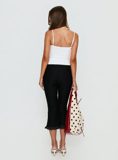 back view of model wearing Princess Polly Darsie Frill Capri Black Polka Dot High Rise Pants Pants 