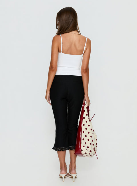 back view of model wearing Princess Polly Darsie Frill Capri Black Polka Dot High Rise Pants Pants 